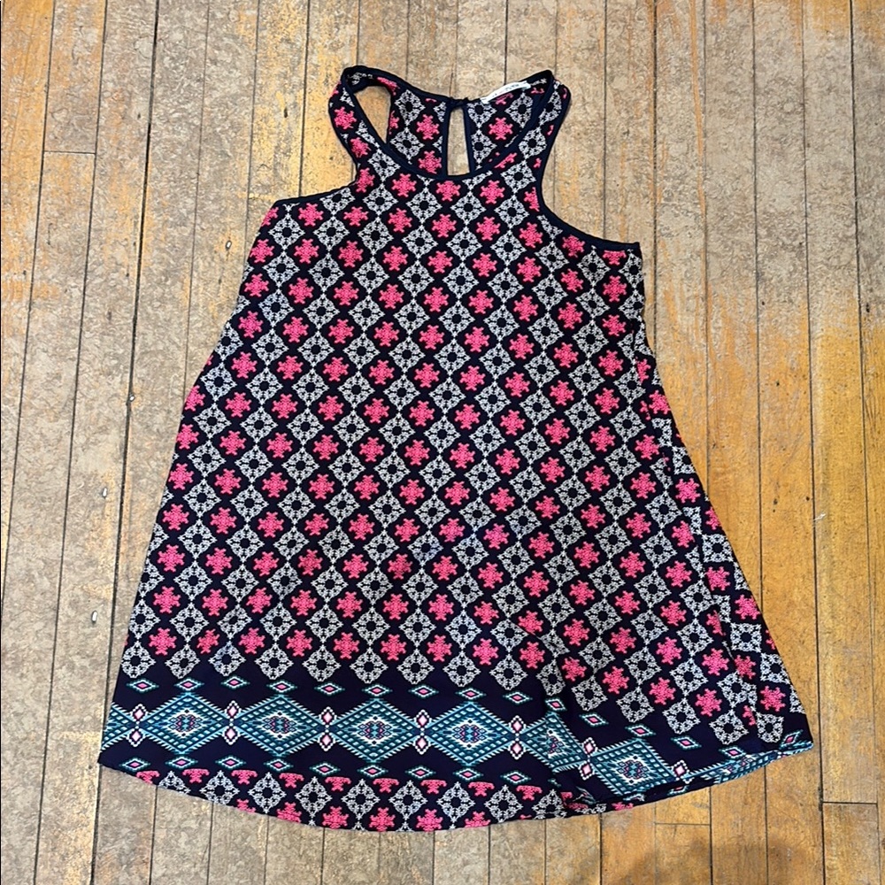 Floral Sleeveless Dress with Geometric Hem
